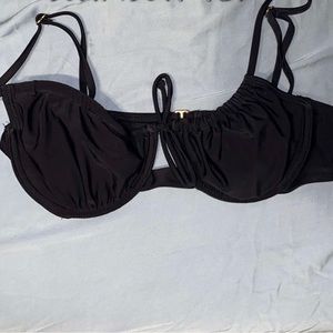 Target black swim suit top that has gold detailing